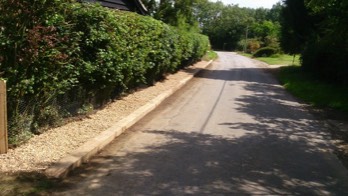  Oak sleepers with a stone finish under the hedge 